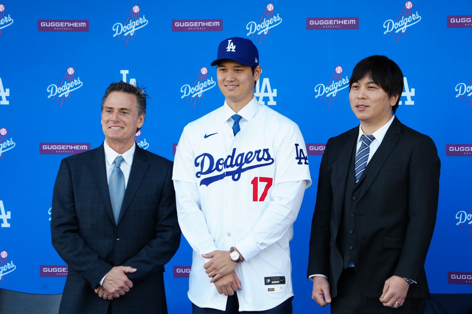 Dec 14, 2023; Los Angeles, CA, USA; Los Angeles Dodgers player Shohei Ohtani stands with his agent Nez Balelo (left) and interpreter Ippei Mizuhara at an introductory press conference at Dodger Stadium.